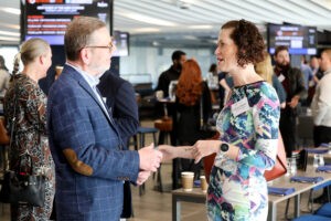 Two people networking at a Network My Club event